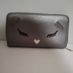 Furla EUC saffiano leather detailed with iconic baby bear shape.